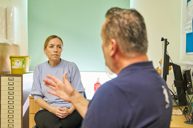 Man speaking to HSCP at Kennedy's disease clinic