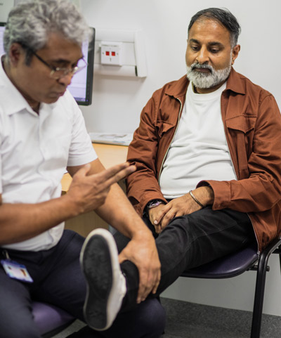 health professional testing reactions of person's leg