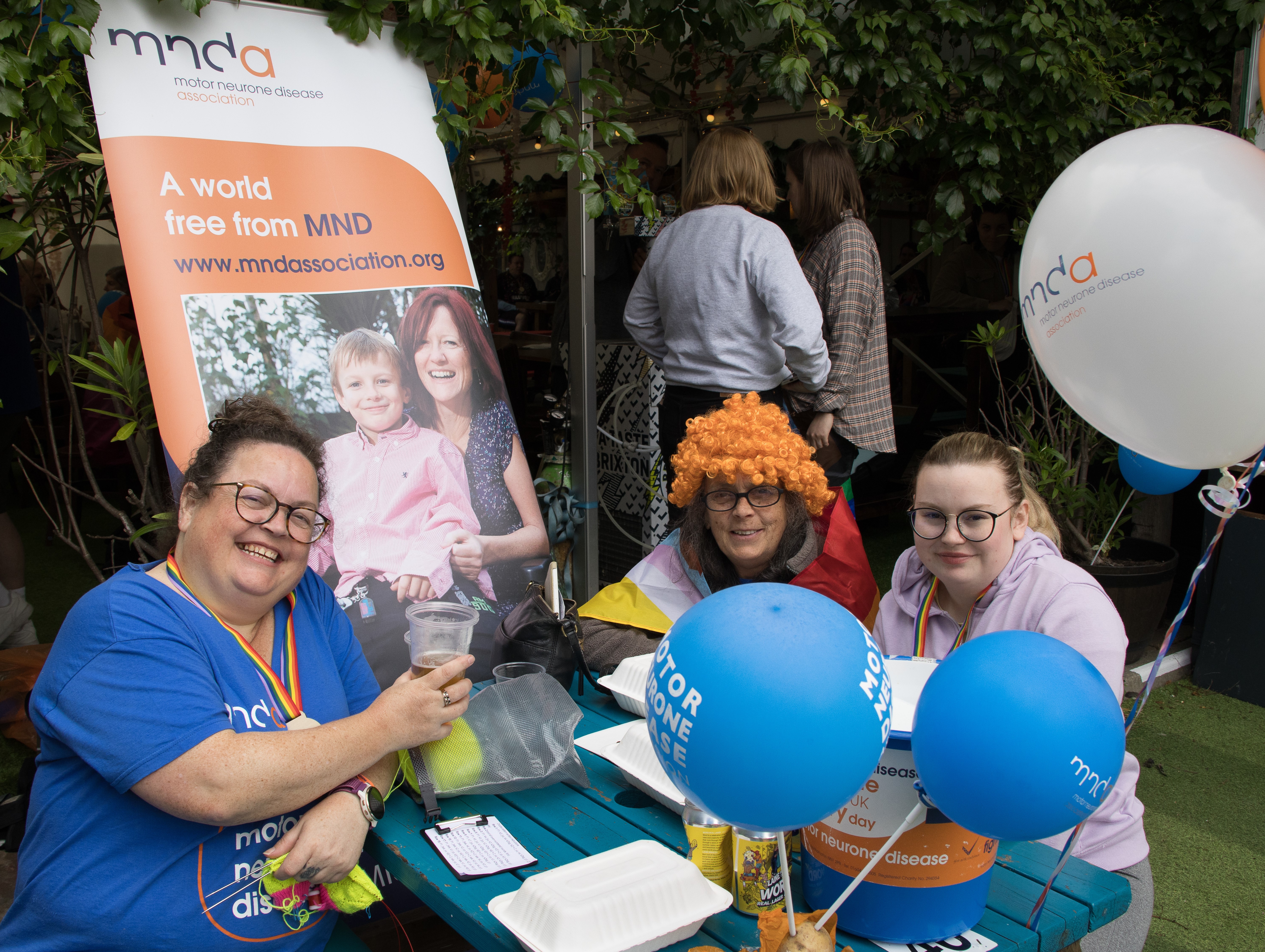 3 West London & Middlesex Branch Volunteers at a fundraising table at the Branch's Walk Event